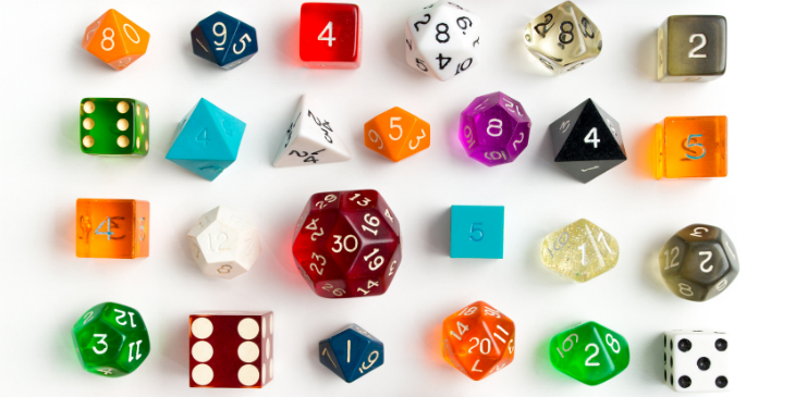 A variety of differently shaped and sized colouful dice