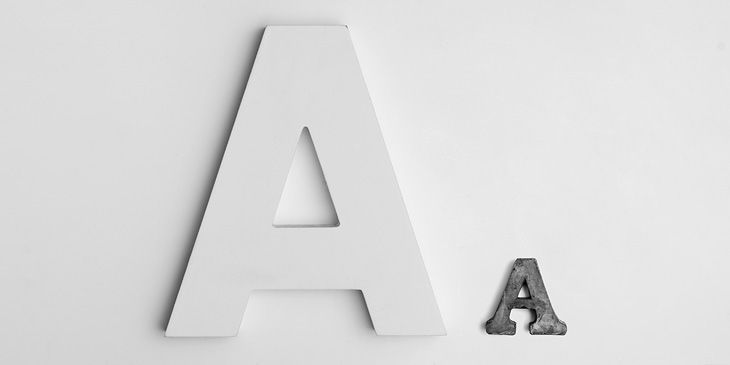 A sans serif A with a small slab serif A next to it