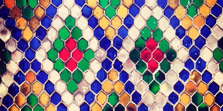 Colourful tiles in a diamond shape repeated