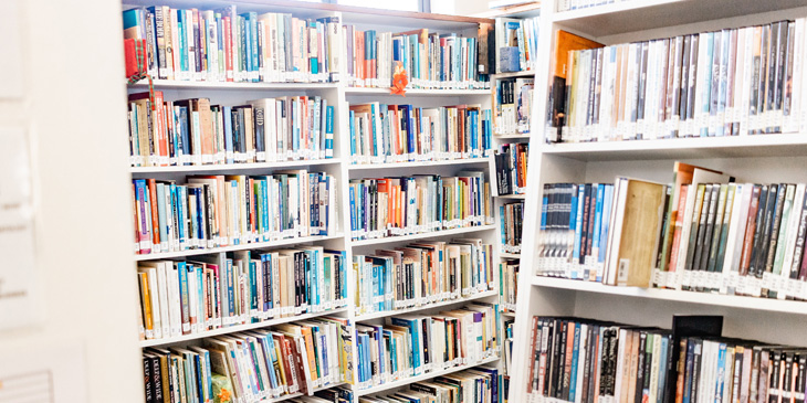 A library with numerous bookcases filled with books