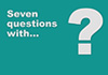 A teal background with the text, 'Seven questions with...' and a giant question mark