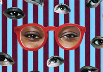 A person wearing red glasses surrounded by multiple cut outs of eyes, with a red and blue striped background